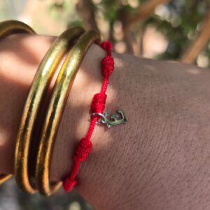 Pulsera 7 nudos inicial E oro